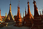 Inle Lake Myanmar. Indein, on the summit of a hill the  Shwe Inn Thein Paya a cluster of hundreds of ancient stupas. Many of them are ruined and overgrown with bushes. 